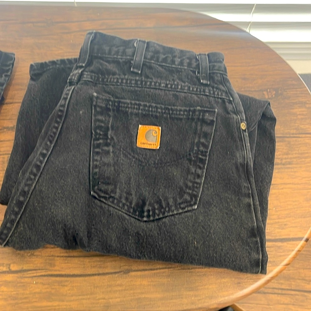Two black pairs of Carhart